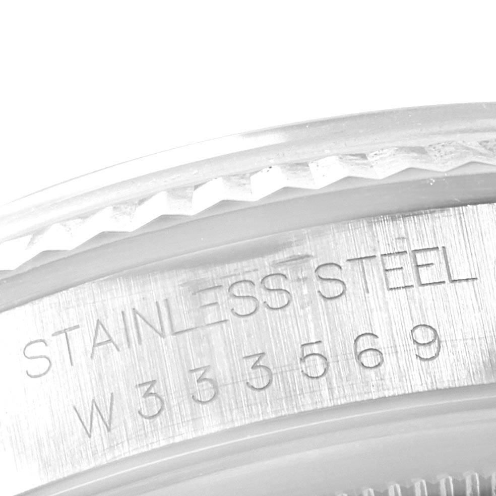 The image shows a close-up of the stainless steel case edge and engraved serial number of a Rolex Datejust 16234 Men's Stainless Steel Silver Dial 16234 Men's Stainless Steel Silver Dial watch.