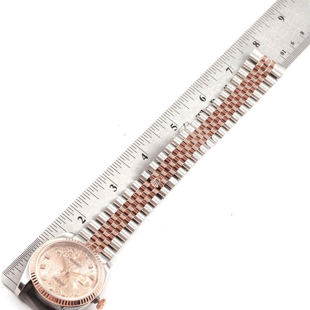 The image shows a Rolex Datejust 116231 Men's Steel and Gold (two tone) Pink Dial 116231 Men's Steel and Gold (two tone) Pink Dial watch laid flat with a ruler measuring the length of its band and case.