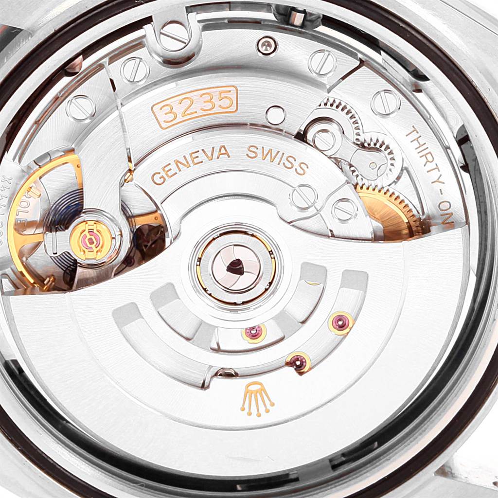 This image shows the movement and intricate mechanical parts of the Rolex Datejust 126300 Men
s Stainless Steel Black Dial 126300 Men
s Stainless Steel Black Dial watch from a rear view.