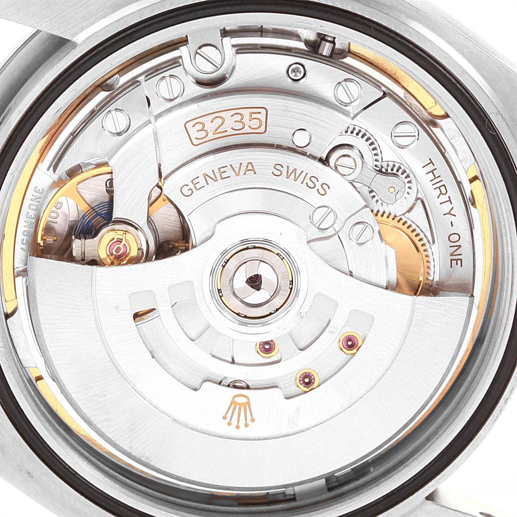 This is a close-up shot of the Rolex Datejust 126300 Men
s Stainless Steel Blue Dial 126300 Men
s Stainless Steel Blue Dial model
s internal mechanism, highlighting the movement and intricate details.