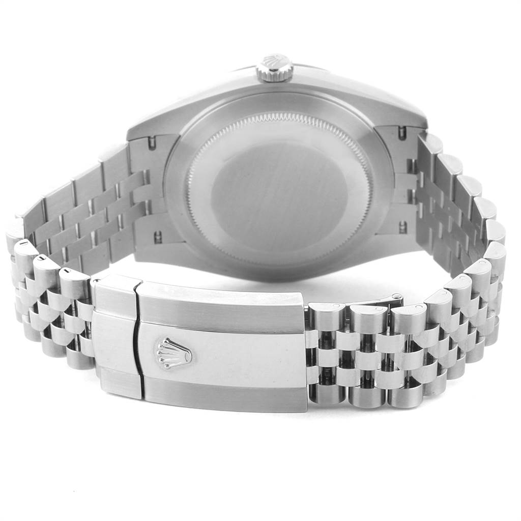 The image shows the back of a Rolex Datejust 126300 Men
s Stainless Steel Blue Dial 126300 Men
s Stainless Steel Blue Dial watch, focusing on the case and the Jubilee bracelet with the clasp open.