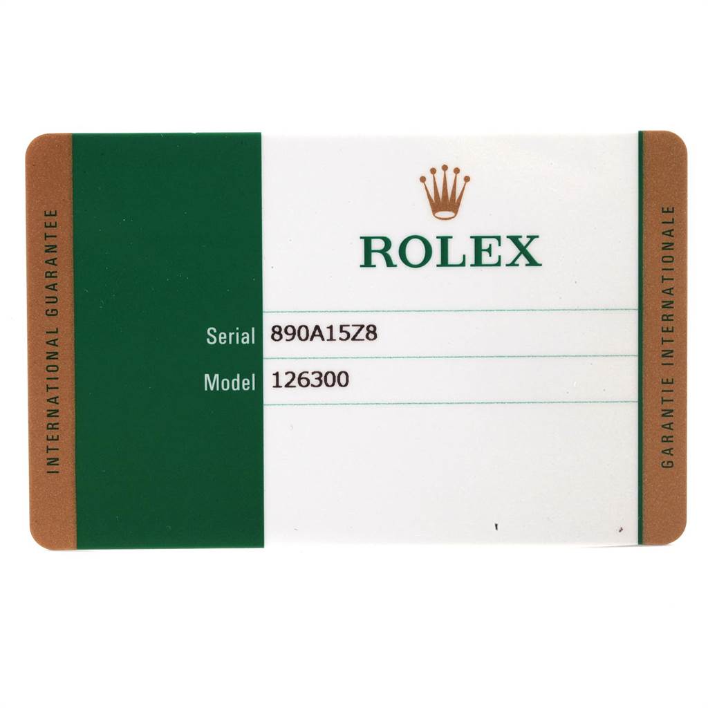 The image shows the international guarantee card for a Rolex Datejust 126300 Men
s Stainless Steel Blue Dial 126300 Men
s Stainless Steel Blue Dial, displaying the serial number and model number 126300.