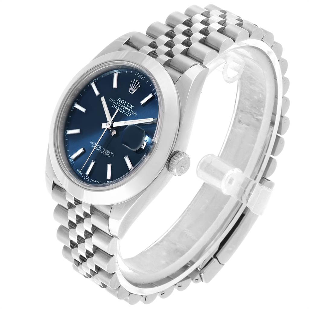 The image shows a Rolex Datejust 126300 Men
s Stainless Steel Blue Dial 126300 Men
s Stainless Steel Blue Dial watch at a three-quarter angle, highlighting the dial, bezel, bracelet, and crown.
