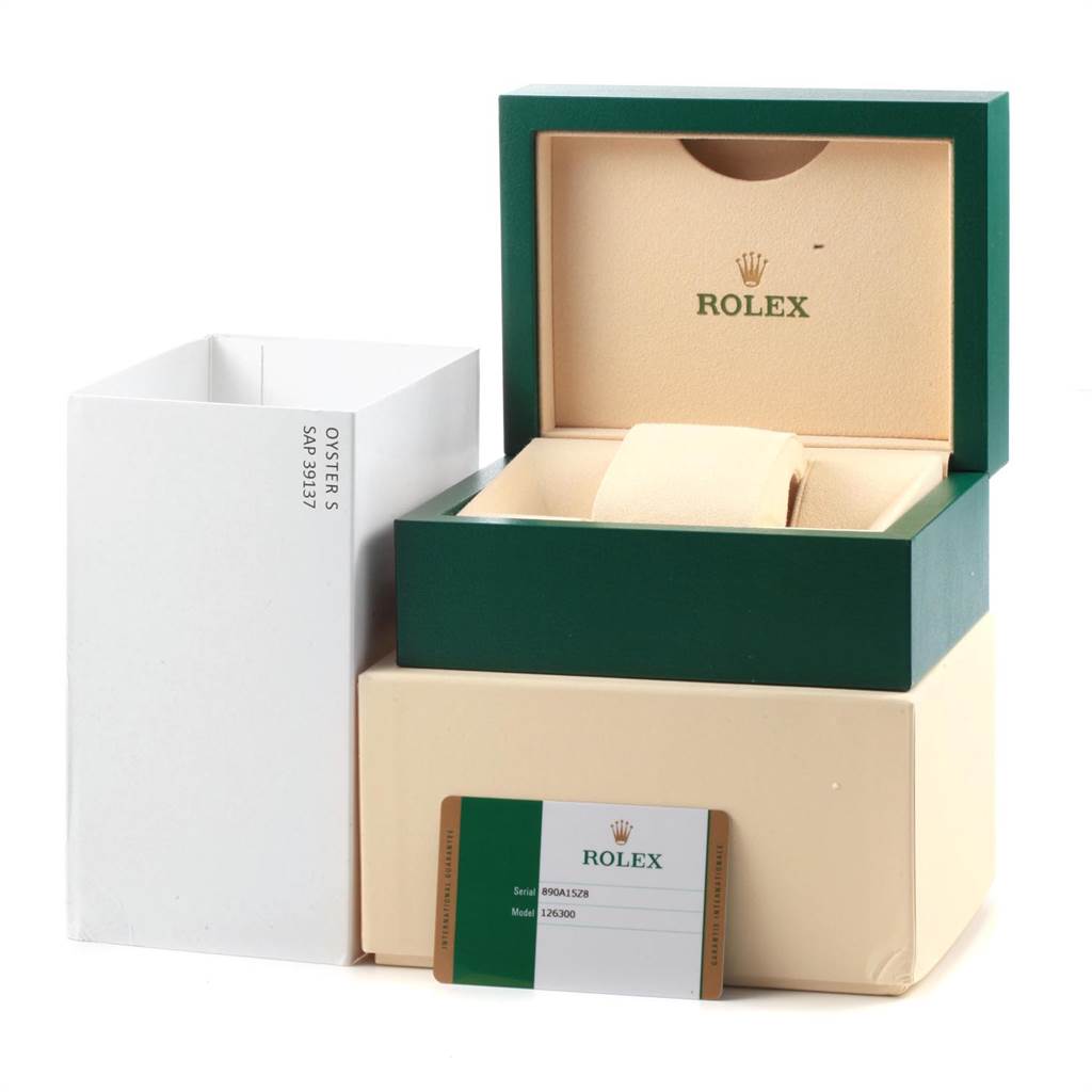 The image shows a Rolex Datejust 126300 Men
s Stainless Steel Blue Dial 126300 Men
s Stainless Steel Blue Dial model packaging with a box, outer sleeve, and warranty card.