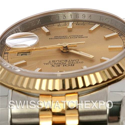 This image shows a close-up angle of the Rolex Datejust 116233-CSJ Men's Stainless Steel Champagne Dial 116233-CSJ Men's Stainless Steel Champagne Dial model's dial, bezel, and part of the bracelet.