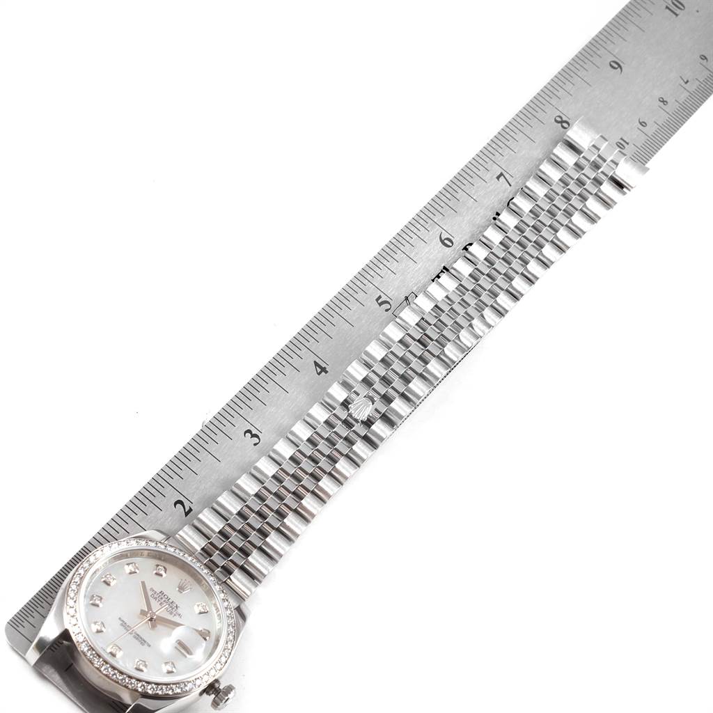 The image shows a Rolex Datejust 116244 Men's Stainless Steel Mother of Pearl Dial 116244 Men's Stainless Steel Mother of Pearl Dial watch positioned alongside a ruler, highlighting its face and bracelet length.