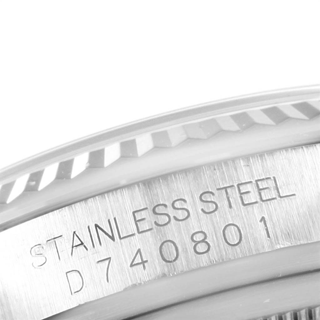 This image shows a close-up of the serial number and "STAINLESS STEEL" engraving on a Rolex Datejust 116234 Men's Stainless Steel Black Dial 116234 Men's Stainless Steel Black Dial watch.