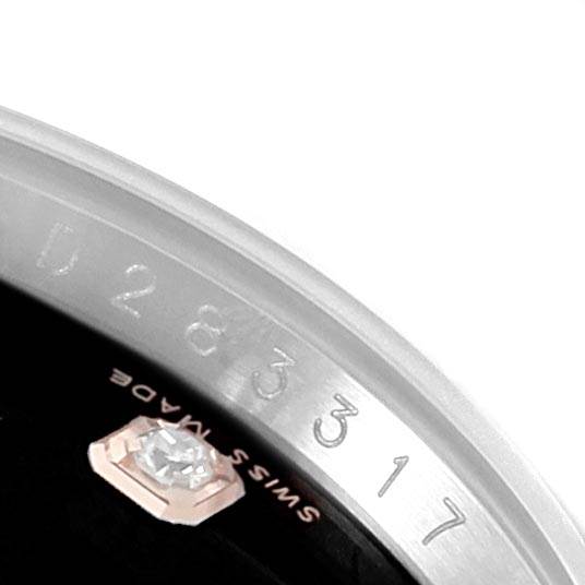 The image shows a close-up angle of the dial and bezel of a Rolex Datejust 116231 Men's Steel and Gold (two tone) Black Dial 116231 Men's Steel and Gold (two tone) Black Dial watch, highlighting a diamond marker and date numerals.