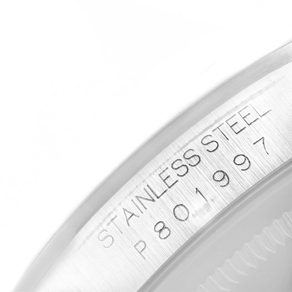 The image shows a close-up of the serial number and "Stainless Steel" engraving on the bezel edge of a Rolex Datejust 16200 Men's Stainless Steel Grey Dial 16200 Men's Stainless Steel Grey Dial watch.