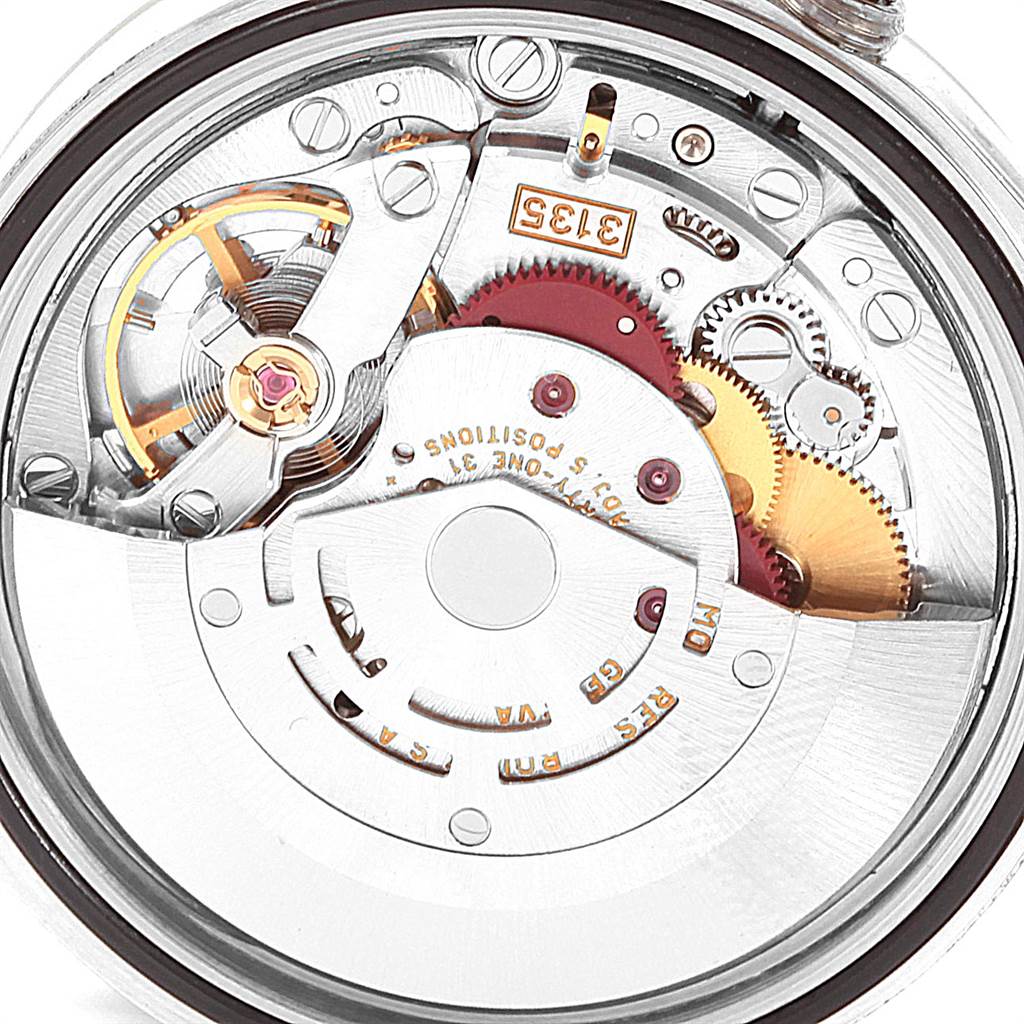 This image shows the inner mechanical movement of a Rolex Datejust 16233 Men's Steel and Gold (two tone) Blue Dial 16233 Men's Steel and Gold (two tone) Blue Dial watch, focusing on its gears and rotor from a top-down angle.