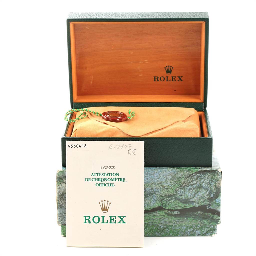 This image shows a Rolex Datejust 16233 Men's Steel and Gold (two tone) Blue Dial 16233 Men's Steel and Gold (two tone) Blue Dial watch box, a certificate, and a watch pouch with a seal.