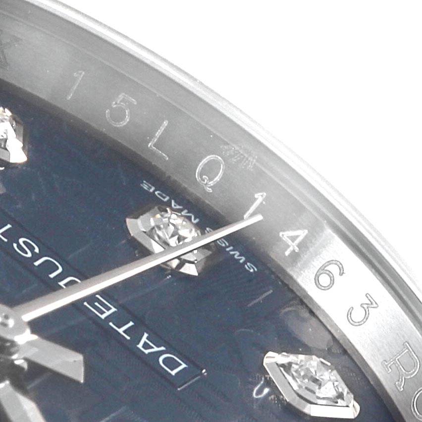 Close-up view of a Rolex Datejust 116244 Men's Stainless Steel Blue Dial 116244 Men's Stainless Steel Blue Dial showing the dial with diamond hour markers and part of the minute hand.