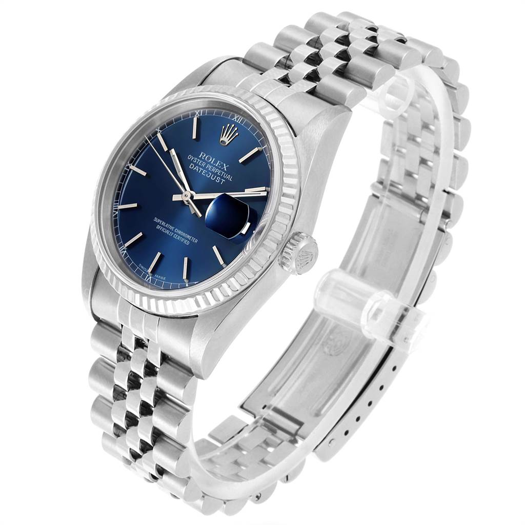 The Rolex Datejust 16234 Men
s Stainless Steel Blue Dial 16234 Men
s Stainless Steel Blue Dial watch is shown at an angle highlighting the face, crown, and partial bracelet.