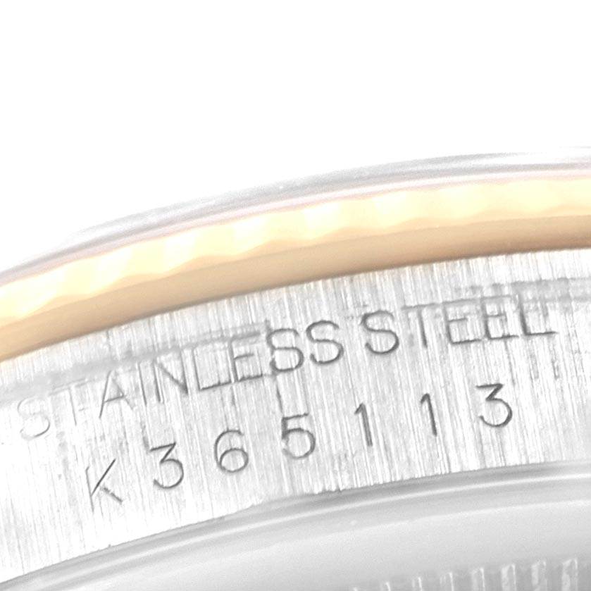The image shows a close-up of the serial number and stainless steel engraving on a Rolex Datejust 16233 Men's Steel and Gold (two tone) Blue Dial 16233 Men's Steel and Gold (two tone) Blue Dial watch case.