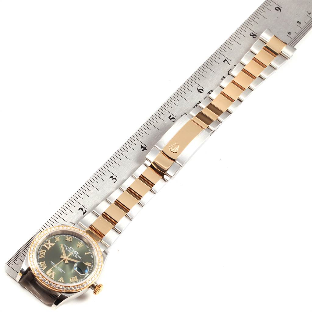 The image shows a Rolex Datejust 126283 Men's Steel and Gold (two tone) Green Dial 126283 Men's Steel and Gold (two tone) Green Dial watch laid flat with a ruler beside it, measuring its length.