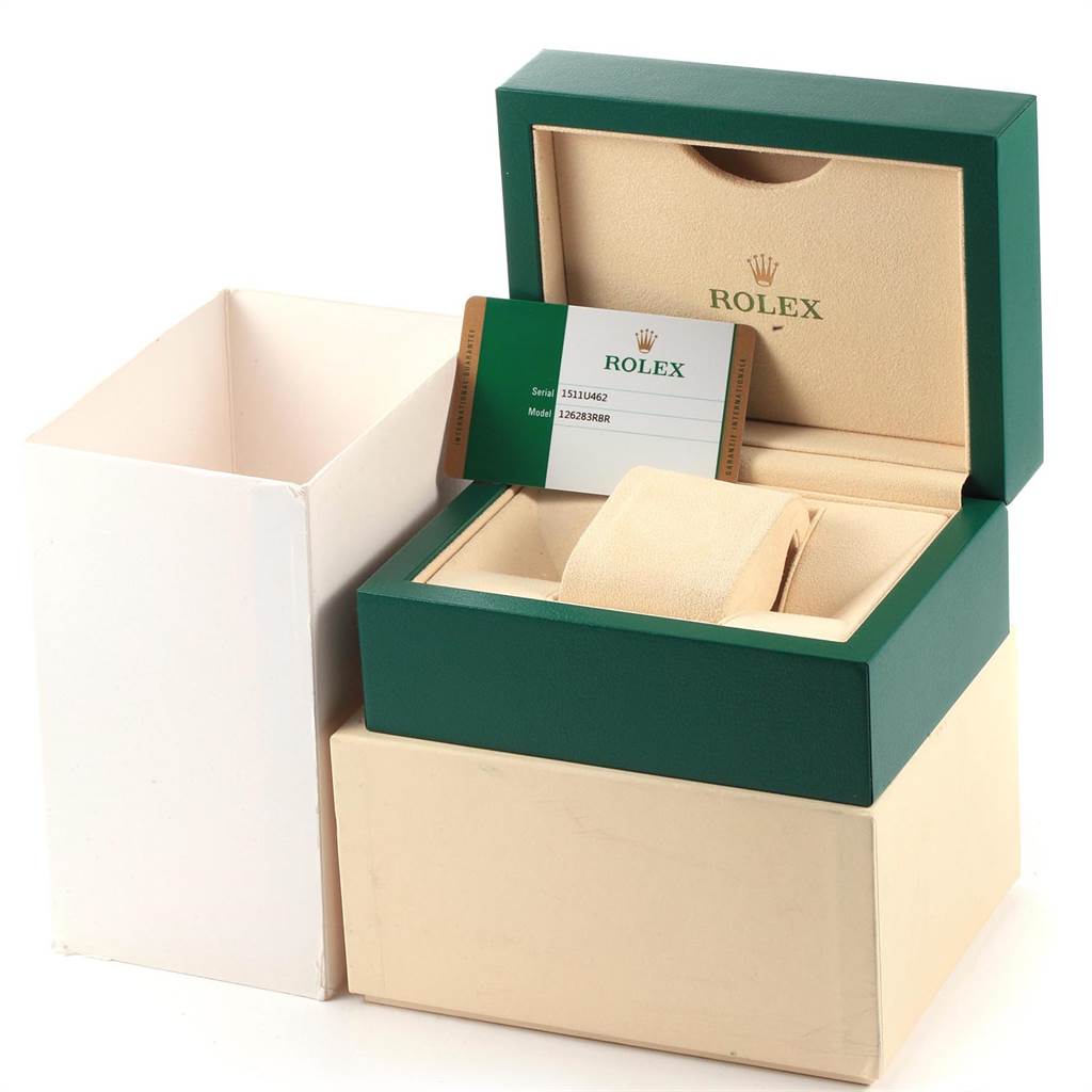 This image shows an open presentation box for a Rolex Datejust 126283 Men's Steel and Gold (two tone) Green Dial 126283 Men's Steel and Gold (two tone) Green Dial watch, featuring a card with serial and model information.