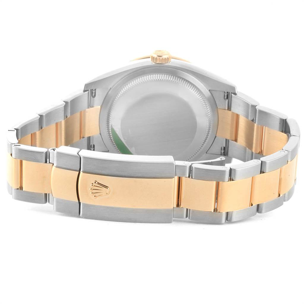 The image shows the back and bracelet of a Rolex Datejust 126283 Men's Steel and Gold (two tone) Green Dial 126283 Men's Steel and Gold (two tone) Green Dial watch, highlighting its two-tone metal design and clasp.