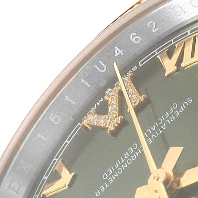 This image shows a close-up of the dial and bezel of a Rolex Datejust 126283 Men's Steel and Gold (two tone) Green Dial 126283 Men's Steel and Gold (two tone) Green Dial watch, highlighting the Roman numerals and part of the hands.