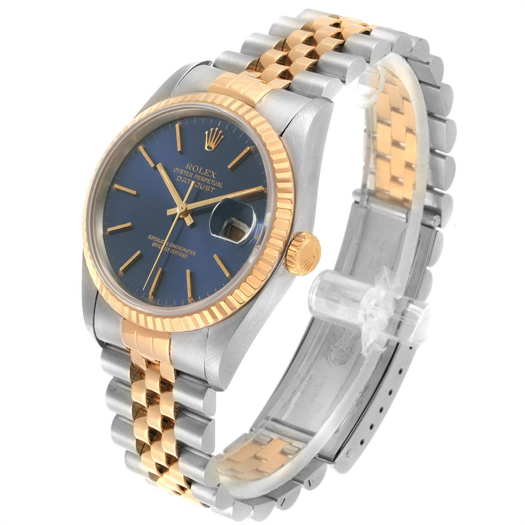 The image shows a side-angle view of a Rolex Datejust 16233 Men
s Steel and Gold (two tone) Blue Dial 16233 Men
s Steel and Gold (two tone) Blue Dial watch featuring a two-tone bracelet and a blue dial.
