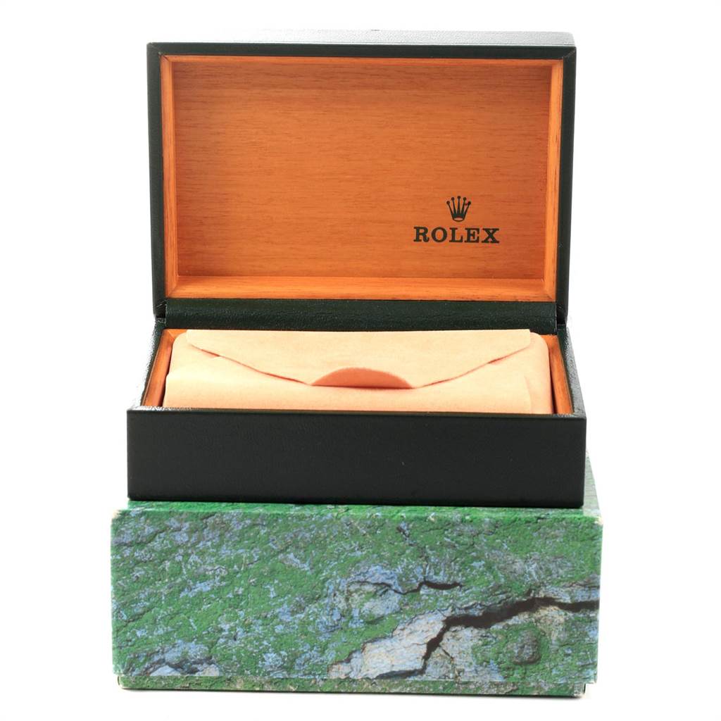 The image shows an open Rolex box with the inner watch pillow, labeling it as a Datejust model.