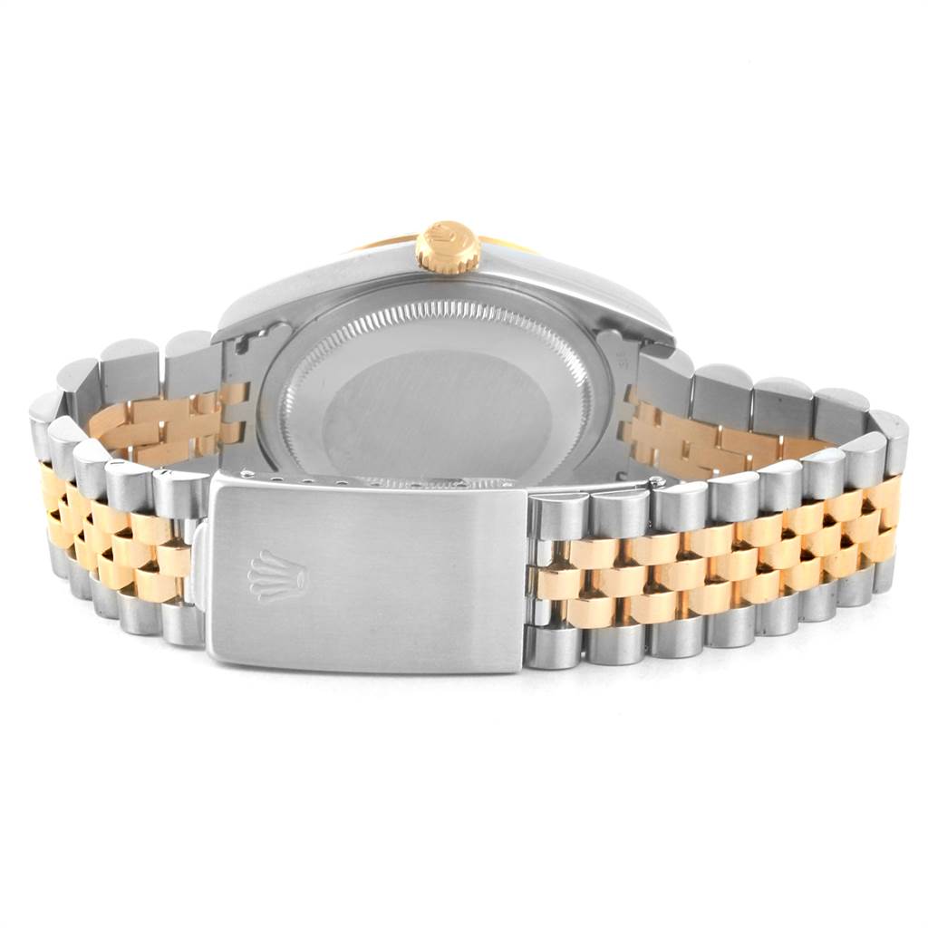 The image shows the back of a Rolex Datejust 16233 Men
s Steel and Gold (two tone) Blue Dial 16233 Men
s Steel and Gold (two tone) Blue Dial watch, focusing on the case back and Jubilee bracelet.