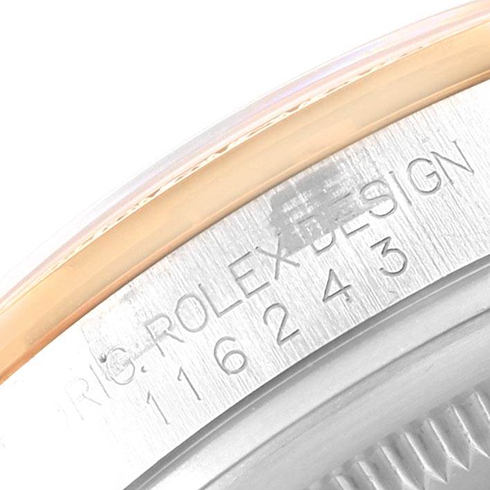 This image shows a close-up of the case back's edge, featuring the model number engraving of a Rolex Datejust 116243 Men's Stainless Steel Black Dial 116243 Men's Stainless Steel Black Dial.