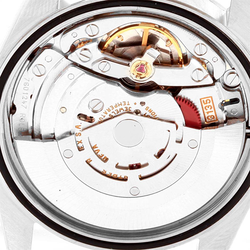This image shows a close-up view of the movement inside a Rolex Datejust 16234 Men
s Stainless Steel Pink Dial 16234 Men
s Stainless Steel Pink Dial watch, highlighting the intricate mechanical components.
