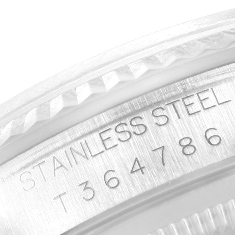 This image shows a close-up of the stainless steel case back of a Rolex Datejust 16234 Men
s Stainless Steel Pink Dial 16234 Men
s Stainless Steel Pink Dial watch, revealing its engraved serial number.