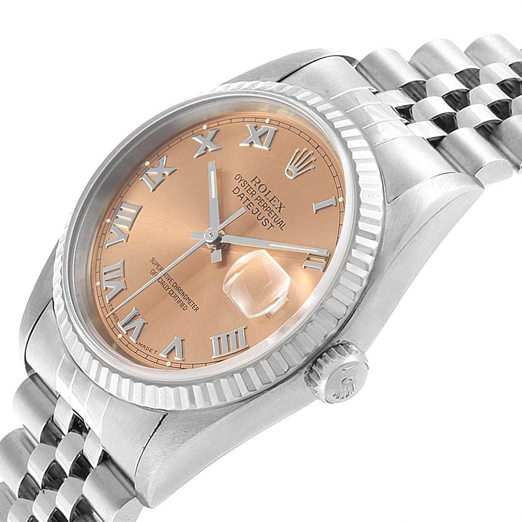This image shows a Rolex Datejust 16234 Men
s Stainless Steel Pink Dial 16234 Men
s Stainless Steel Pink Dial watch at an angle highlighting the bezel, dial, crown, and part of the bracelet.
