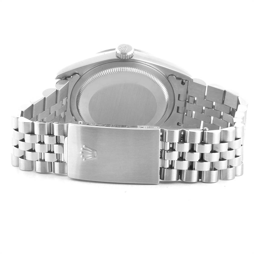 The image shows the back case and the bracelet clasp of a Rolex Datejust 16234 Men
s Stainless Steel Pink Dial 16234 Men
s Stainless Steel Pink Dial watch.