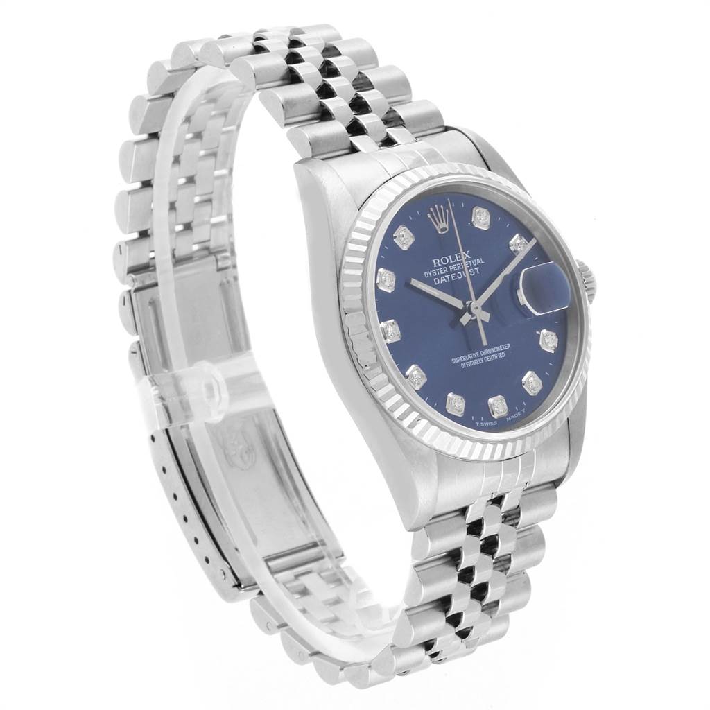 This image shows a Rolex Datejust 16234 Men's Stainless Steel Blue Dial 16234 Men's Stainless Steel Blue Dial watch from a three-quarter angle, highlighting the face, bezel, and bracelet.