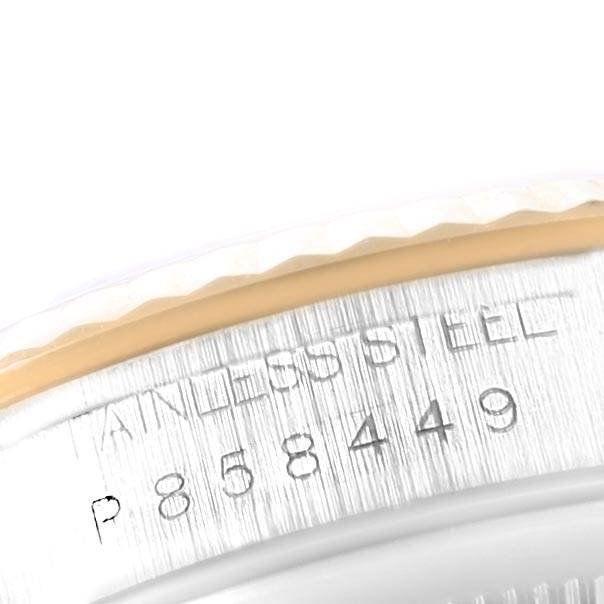 This close-up image shows the stainless steel case back of a Rolex Datejust 16233 Men's Steel and Gold (two tone) Blue Dial 16233 Men's Steel and Gold (two tone) Blue Dial watch, displaying its serial number.