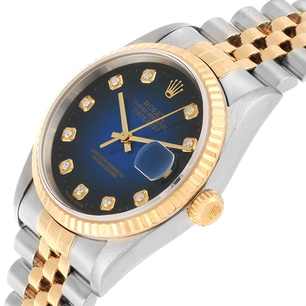 The image shows a side angle of a Rolex Datejust 16233 Men's Steel and Gold (two tone) Blue Dial 16233 Men's Steel and Gold (two tone) Blue Dial watch, featuring a blue dial, gold accents, and part of the Jubilee bracelet.