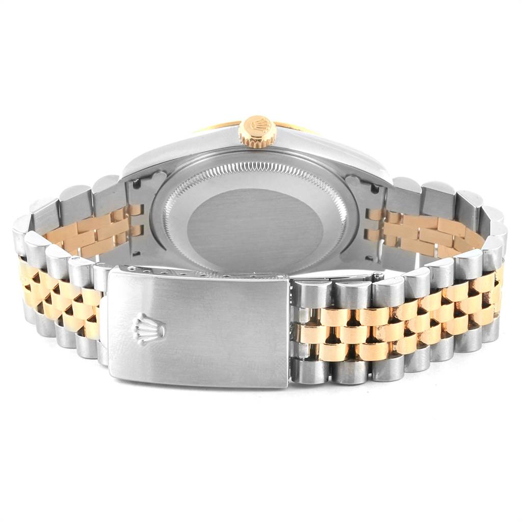 This image shows the back view of a Rolex Datejust 16233 Men's Steel and Gold (two tone) Blue Dial 16233 Men's Steel and Gold (two tone) Blue Dial, featuring its caseback, crown, and a two-tone bracelet with a clasp.