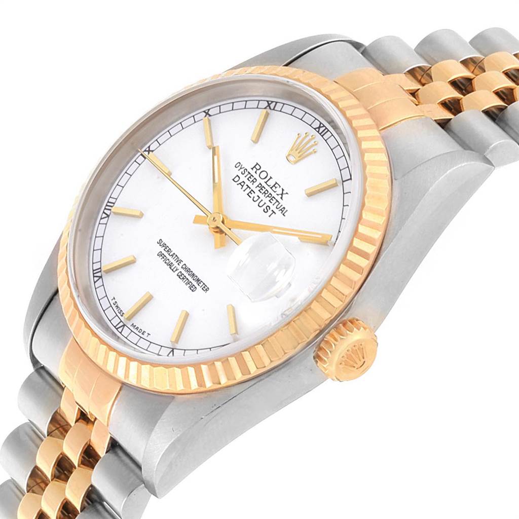 The image shows a close-up of the Rolex Datejust 16233 Men's Steel and Gold (two tone) White Dial 16233 Men's Steel and Gold (two tone) White Dial watch with a white dial, gold fluted bezel, gold and stainless steel bracelet, and crown.