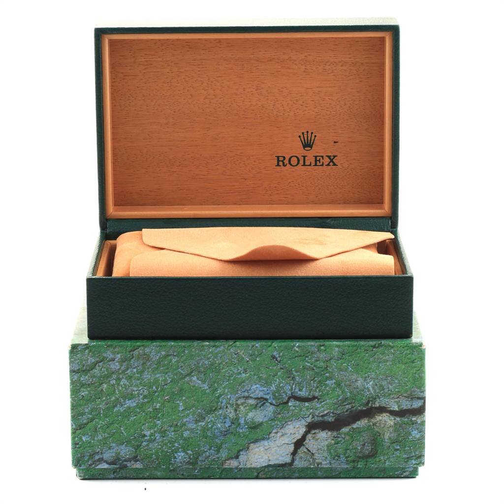 This image shows an open box of a Rolex Datejust 16233 Men
s Steel and Gold (two tone) White Dial 16233 Men
s Steel and Gold (two tone) White Dial watch, revealing the inner wooden lid and a wrapped watch cushion inside.