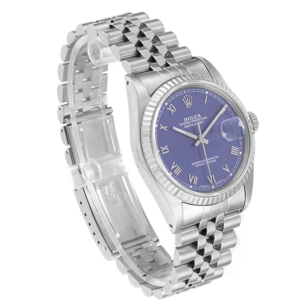 The image shows a Rolex Datejust 16234 Men's Stainless Steel Blue Dial 16234 Men's Stainless Steel Blue Dial watch at a left side angle, highlighting its jubilee bracelet and blue dial with Roman numerals.