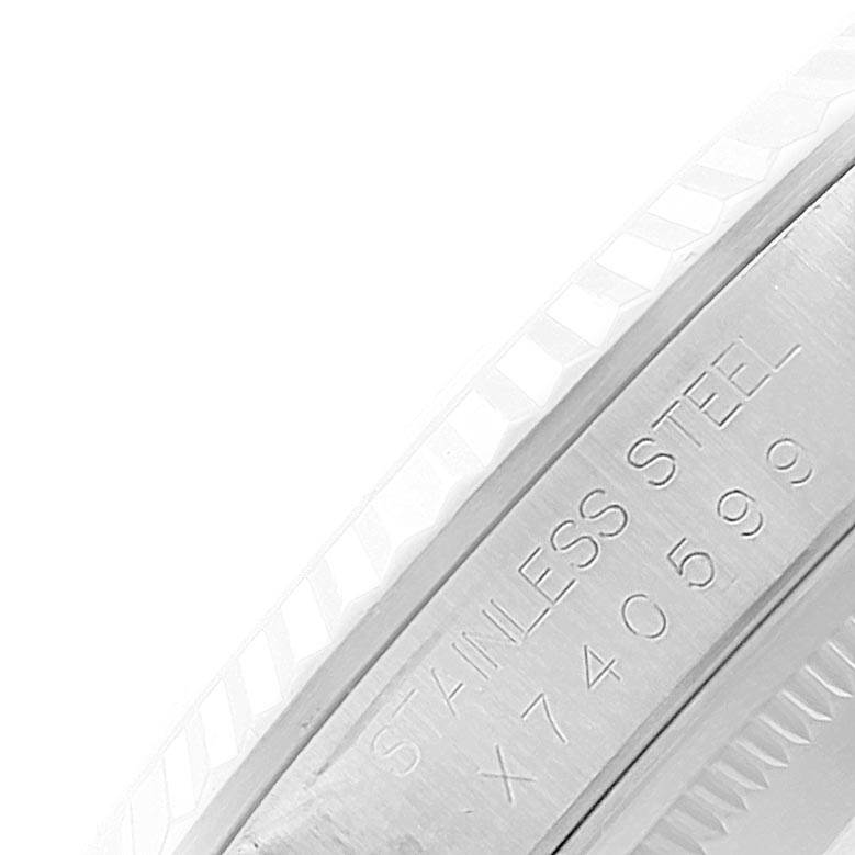 This close-up image shows the engravings on the side of the stainless steel case of a Rolex Datejust 16234 Men's Stainless Steel Blue Dial 16234 Men's Stainless Steel Blue Dial watch.
