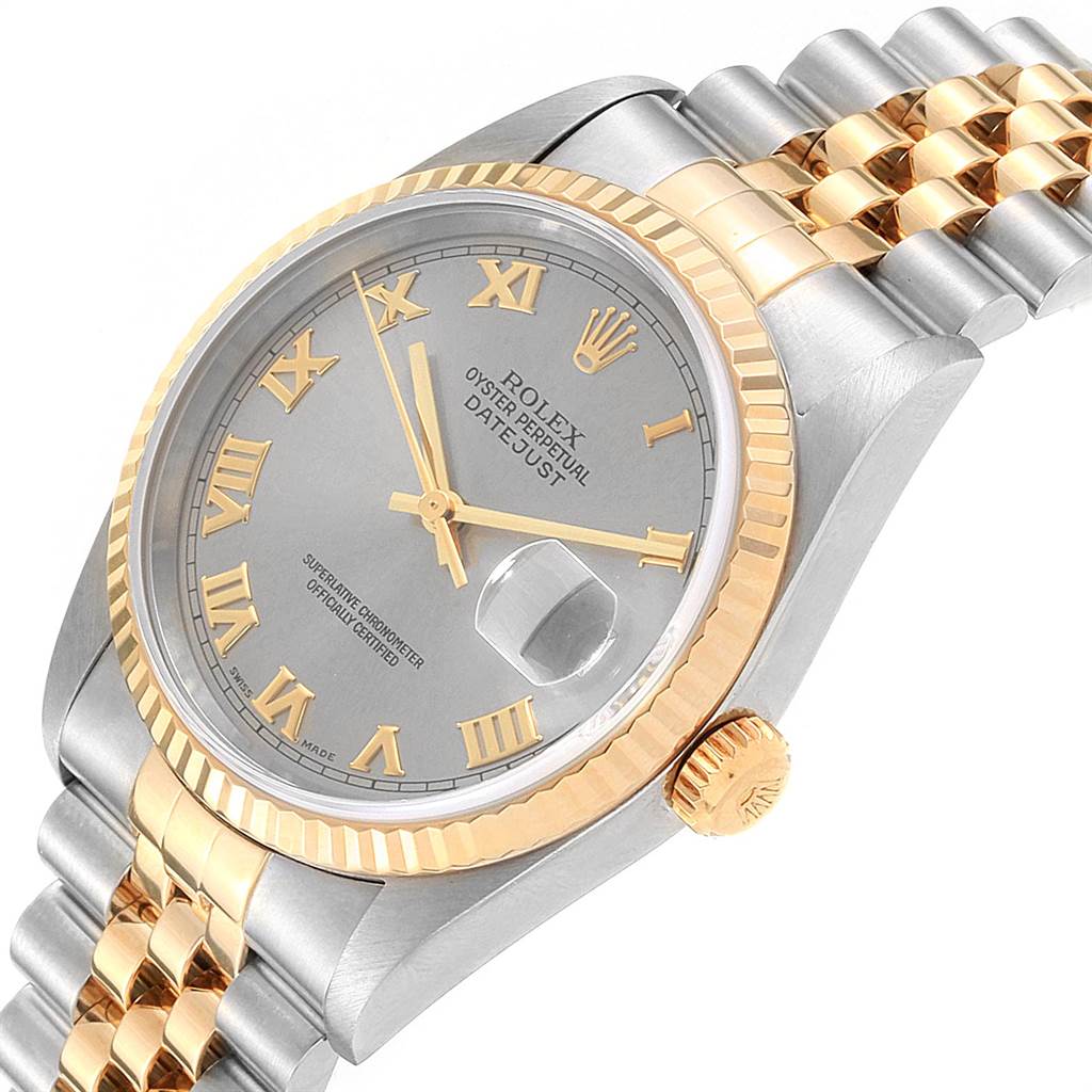 The Rolex Datejust 16233 Men's Steel and Gold (two tone) Grey Dial 16233 Men's Steel and Gold (two tone) Grey Dial watch is shown at an oblique angle, highlighting its dial, fluted bezel, two-tone bracelet, and date magnifier.