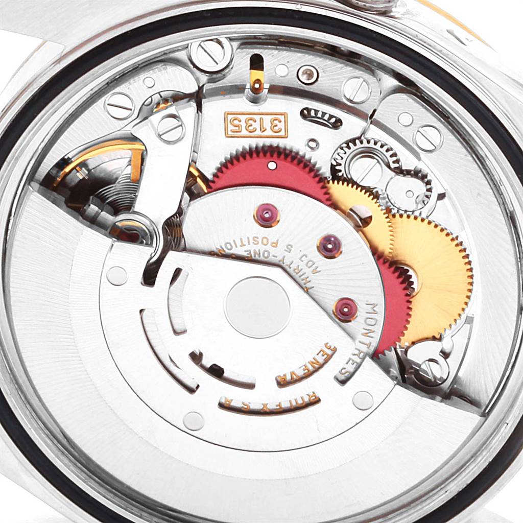 This image shows the internal mechanical movement of a Rolex Datejust 16233 Men's Steel and Gold (two tone) Grey Dial 16233 Men's Steel and Gold (two tone) Grey Dial watch, highlighting gears and components.