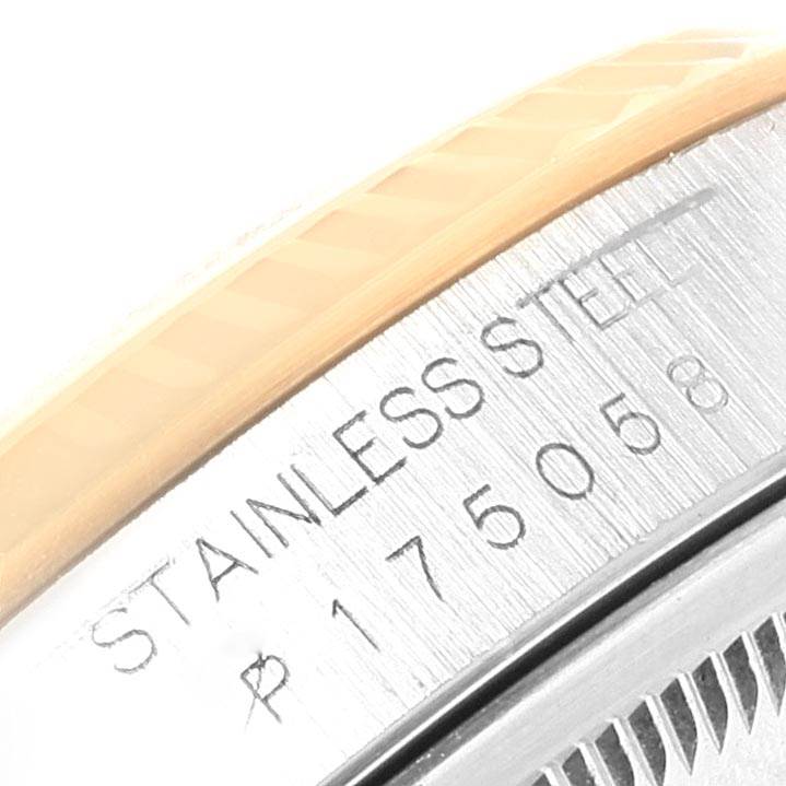 The image shows a close-up of the side of a Rolex Datejust 16233 Men's Steel and Gold (two tone) Grey Dial 16233 Men's Steel and Gold (two tone) Grey Dial watch with serial and model numbers.