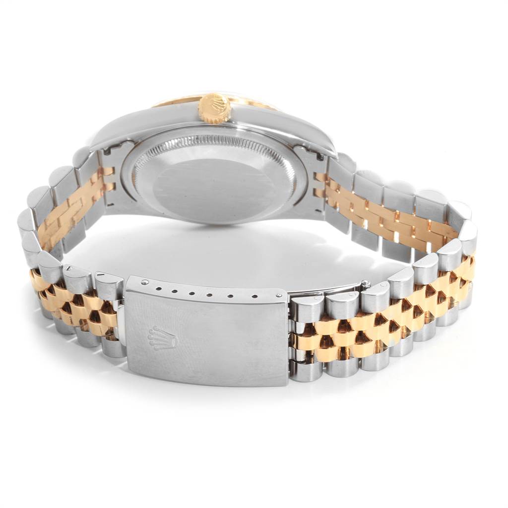 This image shows the back of a Rolex Datejust 16233 Men's Steel and Gold (two tone) Grey Dial 16233 Men's Steel and Gold (two tone) Grey Dial watch including its case, crown, and two-tone bracelet clasp.