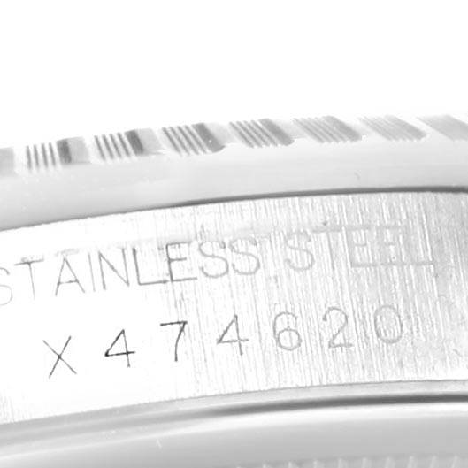 The close-up image shows the serial number and "STAINLESS STEEL" inscription on the case of a Rolex Datejust 16220 Men's Stainless Steel Black Dial 16220 Men's Stainless Steel Black Dial watch.