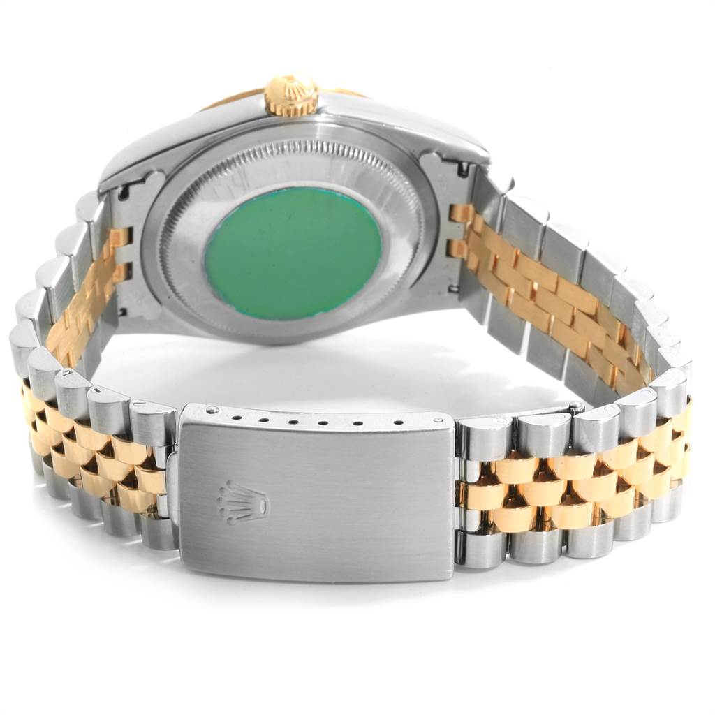 The image shows the back of a Rolex Datejust 16233 Men's Steel and Gold (two tone) Silver Dial 16233 Men's Steel and Gold (two tone) Silver Dial watch, highlighting its caseback and two-tone bracelet with the clasp displayed.