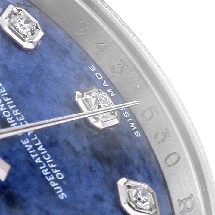 This close-up of the Rolex Datejust 116234 Men's Stainless Steel Blue Dial 116234 Men's Stainless Steel Blue Dial watch shows the blue dial, diamond hour markers, and part of the second hand.