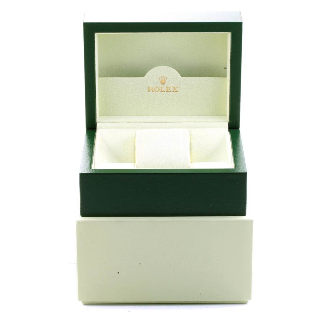 This image shows an open, empty Rolex Datejust 116234 Men's Stainless Steel Black Dial 116234 Men's Stainless Steel Black Dial watch box in green and beige colors.