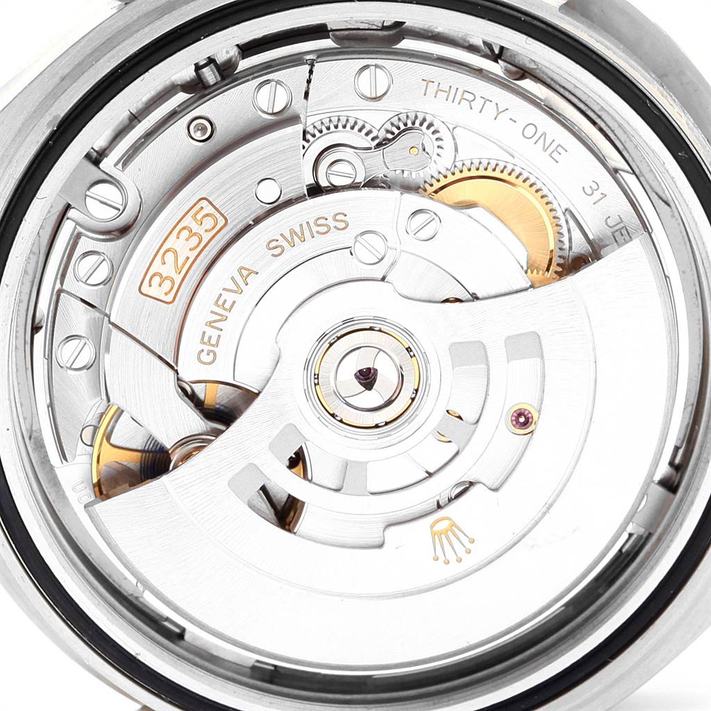 This is an angled view of the Rolex Datejust 126334 Men
s Stainless Steel Grey Dial 126334 Men
s Stainless Steel Grey Dial
s movement, showcasing the intricate inner workings and components.