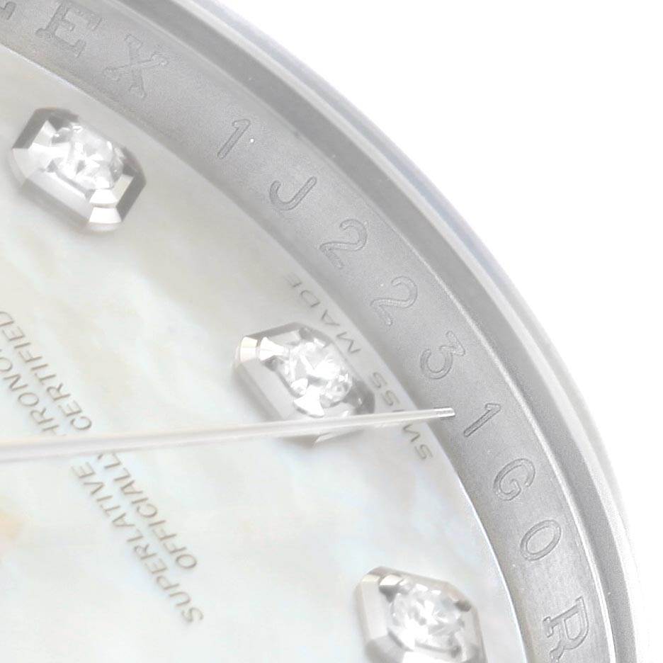 This close-up image shows the dial and part of the bezel of a Rolex Datejust 116234 Men's Stainless Steel Mother of Pearl Dial 116234 Men's Stainless Steel Mother of Pearl Dial, focusing on diamond hour markers and the serial number.