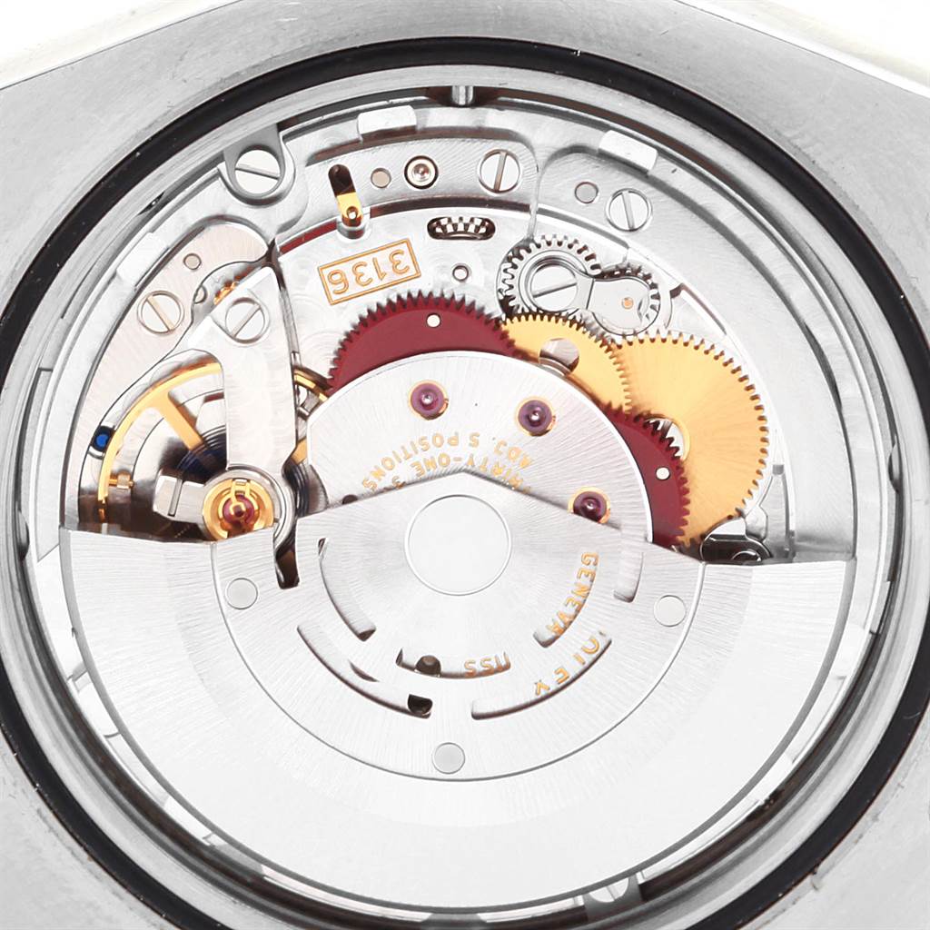 This image shows the intricate internal mechanism and movement parts of a Rolex Datejust 116334 Men
s Stainless Steel Grey Dial 116334 Men
s Stainless Steel Grey Dial watch from a top-down angle.