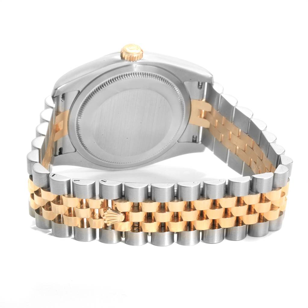 The image shows the back of a Rolex Datejust 116233 Men's Stainless Steel Mother of Pearl Dial 116233 Men's Stainless Steel Mother of Pearl Dial watch and its two-tone metal bracelet.
